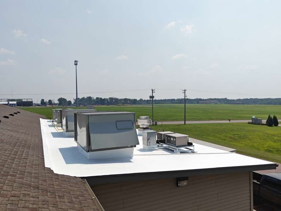 White Full Fabric commercial roof restoration.